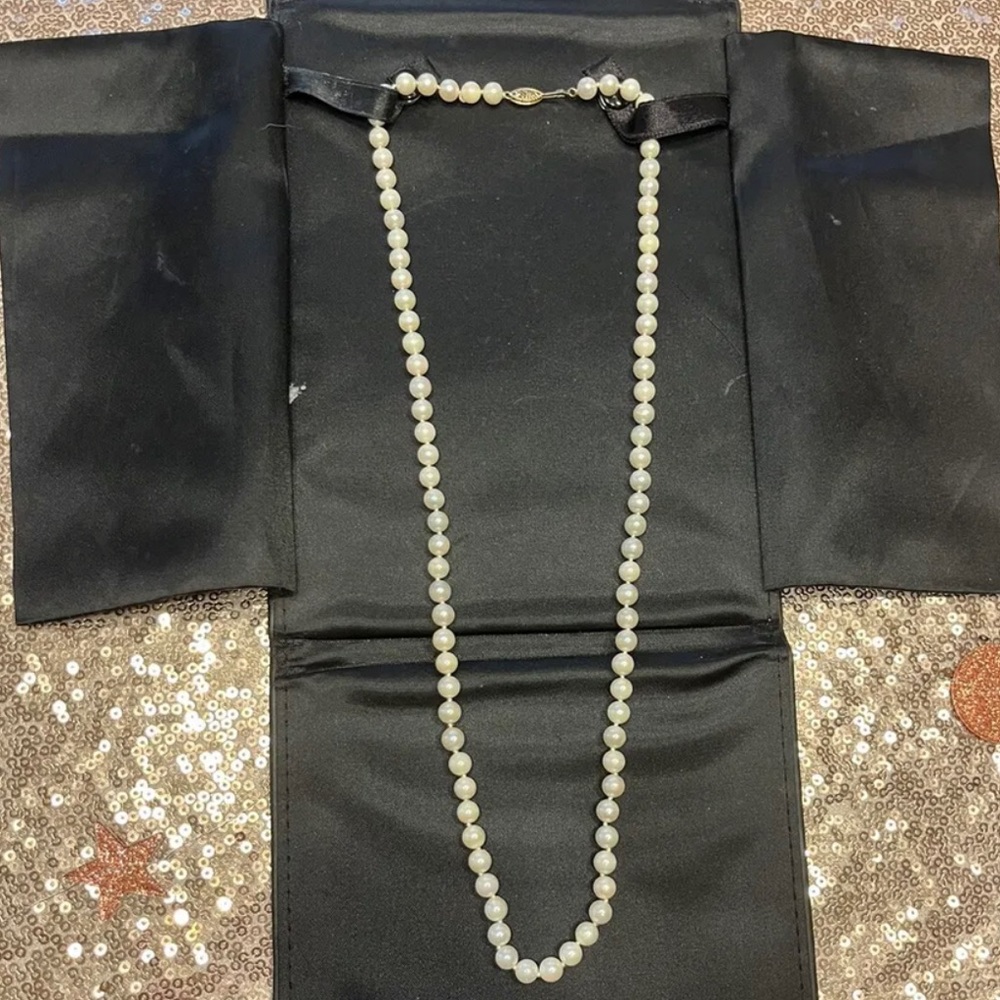 Matinee length high quality pearls.